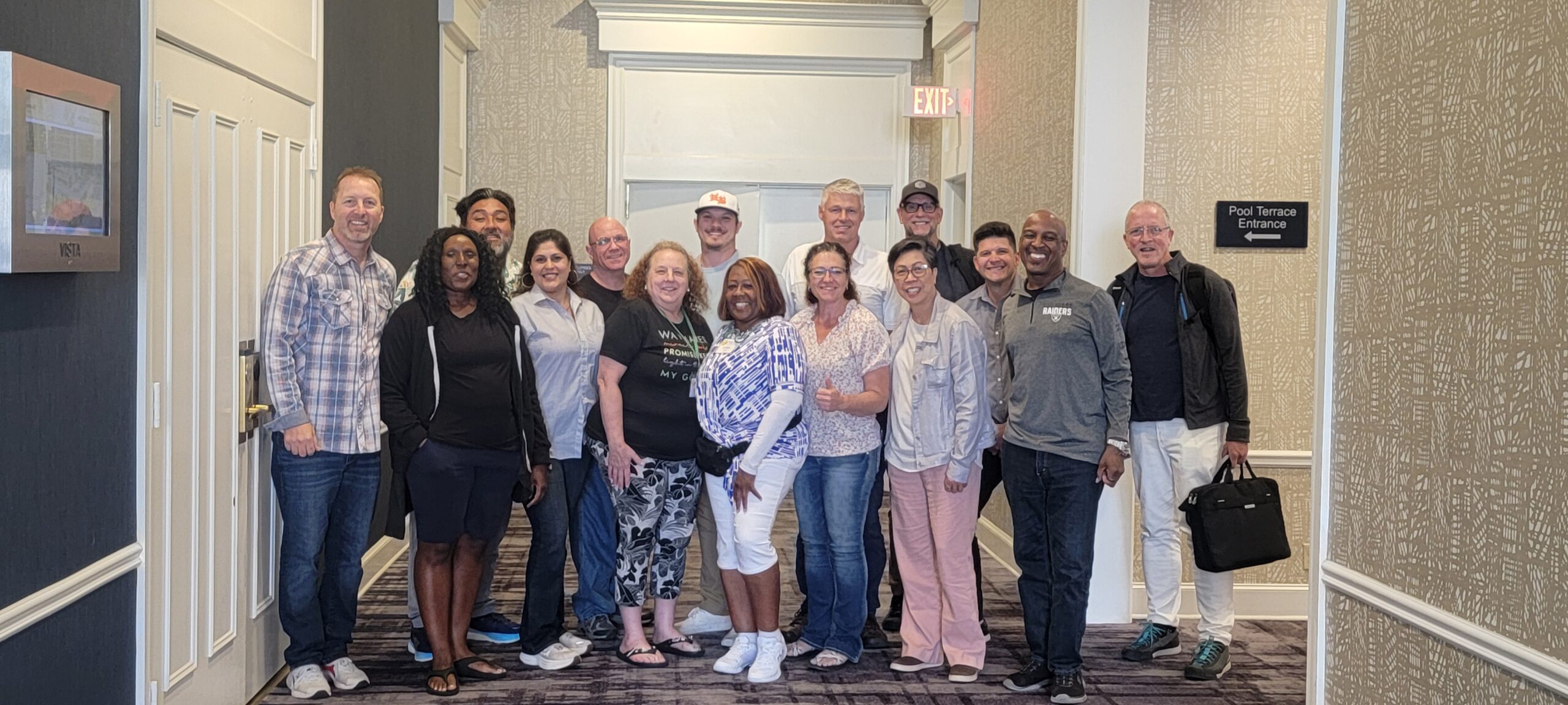 students all ages posing happily